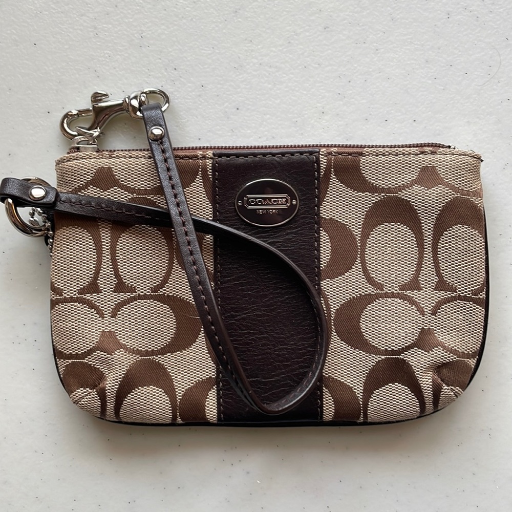 Like new Coach wristlet in brown and tan